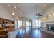 Open living space with a kitchen, fireplace, and access to the backyard at 5185 W Del Rio St, Chandler, AZ 85226
