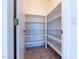 Walk-in pantry with white shelving and tile floor at 5185 W Del Rio St, Chandler, AZ 85226