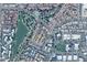 Aerial view of the community showcasing the lush green landscape, lake, and residential area at 563 N Spanish Springs Dr, Chandler, AZ 85226