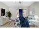 Cozy bedroom featuring a comfortable bed, stylish décor, and ample natural light from a window at 563 N Spanish Springs Dr, Chandler, AZ 85226