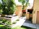 Inviting home with walkway and well-maintained landscaping, including desert landscaping at 563 N Spanish Springs Dr, Chandler, AZ 85226