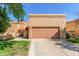 Charming single-story home with a well-maintained front yard and two-car garage at 563 N Spanish Springs Dr, Chandler, AZ 85226