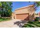 A clean, 2 car garage and driveway highlight the front exterior of this home at 563 N Spanish Springs Dr, Chandler, AZ 85226