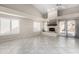 Bright living room with vaulted ceiling, ceiling fan, fireplace, and tile flooring at 563 N Spanish Springs Dr, Chandler, AZ 85226