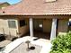 View of the backyard patio, showing the layout of the exterior and access to the house at 563 N Spanish Springs Dr, Chandler, AZ 85226
