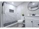 Updated bathroom with modern vanity, tiled shower, and sleek fixtures at 6130 N 27Th Ave, Phoenix, AZ 85017