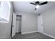Bright bedroom featuring neutral paint, carpet, closet with light, and natural light at 6130 N 27Th Ave, Phoenix, AZ 85017