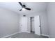 Cozy bedroom with neutral paint, carpet, ceiling fan, closet, and closet light at 6130 N 27Th Ave, Phoenix, AZ 85017