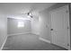 Bedroom features neutral paint, carpet, ceiling fan, and bright natural light at 6130 N 27Th Ave, Phoenix, AZ 85017