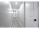 Bright hallway featuring wood-look floors leading to the front door at 6130 N 27Th Ave, Phoenix, AZ 85017