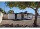 Home with a covered patio, gravel landscaping, and a classic exterior paint scheme at 6130 N 27Th Ave, Phoenix, AZ 85017