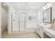 Bright bathroom featuring a glass-enclosed shower, and separate tub at 634 E Deer Creek Rd, Phoenix, AZ 85048