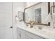 Bright bathroom features a dual sink vanity with a decorative vase and two mirrors at 634 E Deer Creek Rd, Phoenix, AZ 85048