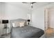 Cozy bedroom featuring a queen bed with decorative pillows and stylish bedside tables and lamps at 634 E Deer Creek Rd, Phoenix, AZ 85048