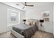 Cozy bedroom featuring a queen bed with decorative pillows and stylish bedside tables and lamps at 634 E Deer Creek Rd, Phoenix, AZ 85048