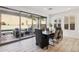 Dining room with a view of the outdoor patio and pool, and modern decor at 634 E Deer Creek Rd, Phoenix, AZ 85048