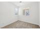 Bright, empty room with neutral carpet and bright, natural light. Great for customization at 634 E Deer Creek Rd, Phoenix, AZ 85048