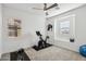 Exercise room with stationary bike, neutral carpet and bright, natural light at 634 E Deer Creek Rd, Phoenix, AZ 85048