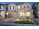 Charming two-story home featuring a brick facade, well-manicured landscaping, and a two-car garage at 634 E Deer Creek Rd, Phoenix, AZ 85048