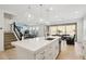 Spacious open kitchen with a large island, pendant lights, and seamless transition to living and dining spaces at 634 E Deer Creek Rd, Phoenix, AZ 85048