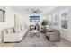 Bright living room with neutral palette, modern ceiling fan, and stylish decor at 634 E Deer Creek Rd, Phoenix, AZ 85048