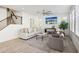 Bright living room with neutral palette, modern ceiling fan, and stylish decor at 634 E Deer Creek Rd, Phoenix, AZ 85048