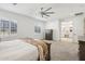 Spacious main bedroom featuring soft carpet, a ceiling fan, and neutral decor at 634 E Deer Creek Rd, Phoenix, AZ 85048