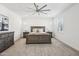 Spacious main bedroom featuring soft carpet, a ceiling fan, and neutral decor at 634 E Deer Creek Rd, Phoenix, AZ 85048