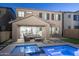Backyard patio featuring a pool with accent lighting, stylish outdoor furniture, and covered patio space at 634 E Deer Creek Rd, Phoenix, AZ 85048