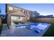 Beautiful backyard pool with accent lighting and a covered patio with comfortable outdoor seating at 634 E Deer Creek Rd, Phoenix, AZ 85048