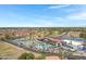 Beautiful aerial shot of a Primary-planned community featuring a golf course, lake, and community pool at 6341 S Cypress Point Dr, Chandler, AZ 85249