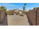 Spacious backyard featuring desert landscaping and a charming pergola perfect for outdoor relaxation at 6341 S Cypress Point Dr, Chandler, AZ 85249