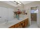 This bright bathroom has a long double vanity and a mirror that covers the entire wall at 6341 S Cypress Point Dr, Chandler, AZ 85249