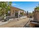 Relaxing covered patio featuring comfortable seating, desert plants, and scenic backyard views at 6341 S Cypress Point Dr, Chandler, AZ 85249