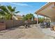 A cozy covered patio featuring desert landscaping, furniture, a brick wall, and a calming atmosphere at 6341 S Cypress Point Dr, Chandler, AZ 85249