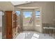 Bright dining nook with large windows offering ample natural light, complemented by tile flooring and neutral decor at 6341 S Cypress Point Dr, Chandler, AZ 85249