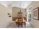 Elegant dining room with high ceilings, chandelier, and sliding glass doors to the outdoor area at 6341 S Cypress Point Dr, Chandler, AZ 85249