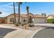 Beautiful single-story home with desert landscaping, tile roof, and palm trees in a well-maintained neighborhood at 6341 S Cypress Point Dr, Chandler, AZ 85249