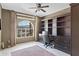 Home office featuring built-in shelves, a large window, and a comfortable workspace at 6341 S Cypress Point Dr, Chandler, AZ 85249