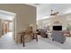 Open-concept living room with high ceilings, tile entry, plush carpet, and abundant natural light at 6341 S Cypress Point Dr, Chandler, AZ 85249