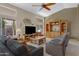 Comfortable living room featuring vaulted ceilings, large windows, and a cozy seating arrangement at 6341 S Cypress Point Dr, Chandler, AZ 85249