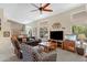 Bright living room with vaulted ceilings, neutral paint, comfortable seating, and a large entertainment center at 6341 S Cypress Point Dr, Chandler, AZ 85249