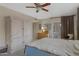 This bright main bedroom has neutral walls, carpet, and access to a sliding glass door at 6341 S Cypress Point Dr, Chandler, AZ 85249