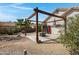 Inviting patio area with a rustic pergola and seating, ideal for entertaining guests at 6341 S Cypress Point Dr, Chandler, AZ 85249