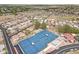 Aerial view featuring blue tennis courts and nearby community homes with beautiful landscaping at 6341 S Cypress Point Dr, Chandler, AZ 85249