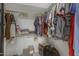 This walk-in closet has rods and shelves for ample storage at 6341 S Cypress Point Dr, Chandler, AZ 85249