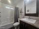 Bathroom with updated fixtures, white tile surround, and granite counter at 650 N Hawes Rd # 3123, Mesa, AZ 85207