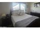 Comfortable bedroom with large bed and bright natural lighting at 650 N Hawes Rd # 3123, Mesa, AZ 85207