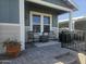 Inviting front porch with chairs, potted plant, and brick-paved floor at 650 N Hawes Rd # 3123, Mesa, AZ 85207