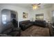 Comfortable living room with plush seating, ceiling fan, and access to the kitchen and dining areas at 650 N Hawes Rd # 3123, Mesa, AZ 85207